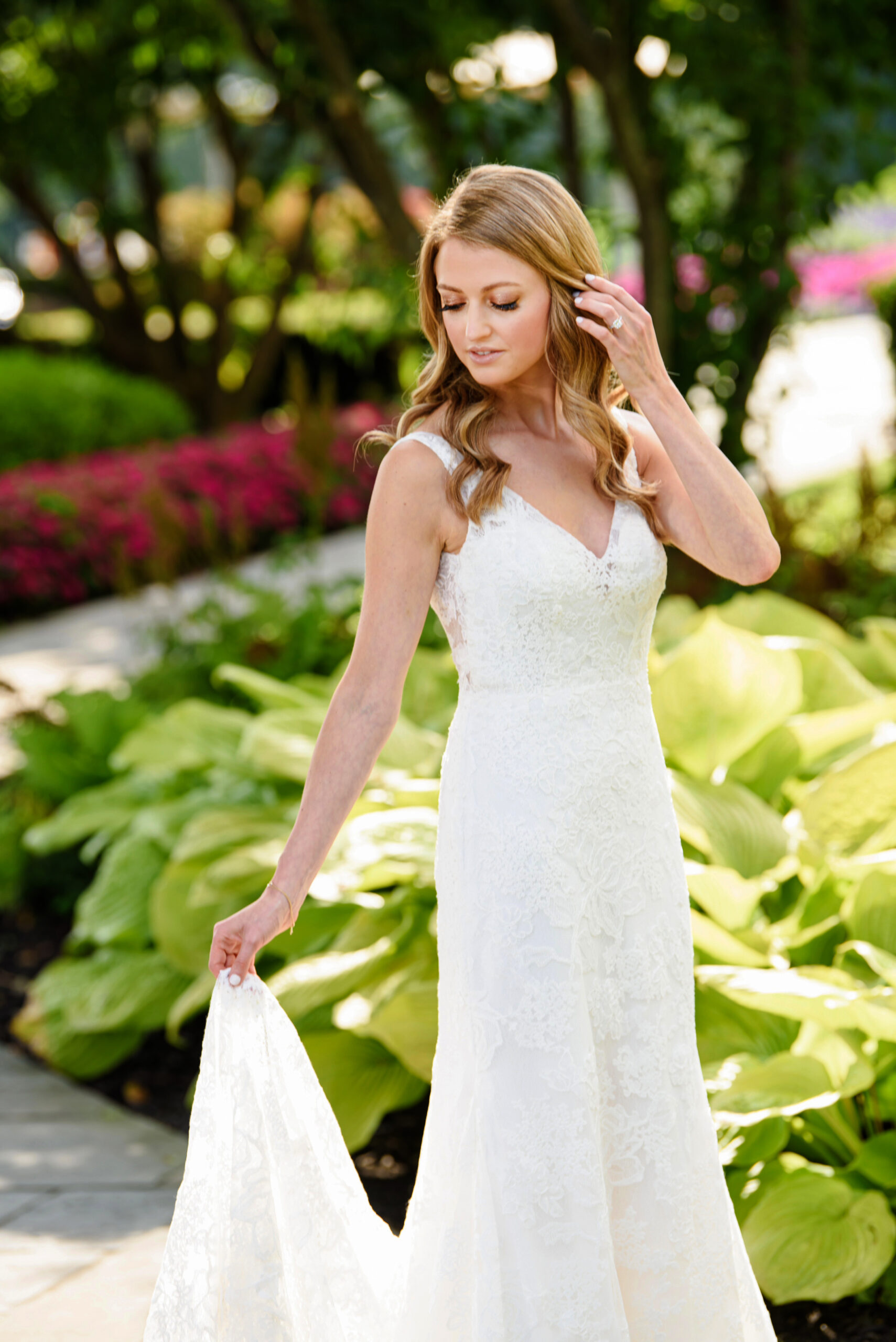 A beautiful bride walking on a cement path